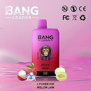 A pink vape bottle with the BANG LEADER branding sits on a glossy pink surface, showing 45000 puffs and the Lychee Ice Melon Jam flavor; a cartoon character is on the bottle label, with lychee and melon fruits and ice cubes in the foreground.