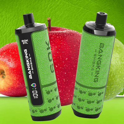 Two green energy drink bottles with black caps and labels, positioned in front of red and green fruit